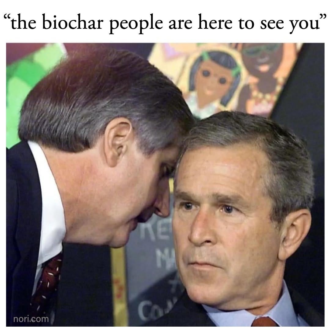 Text: "'the biochar people are here to see you'". Below, the well-known photo of an aide whispering into a US president's ear in a classroom.