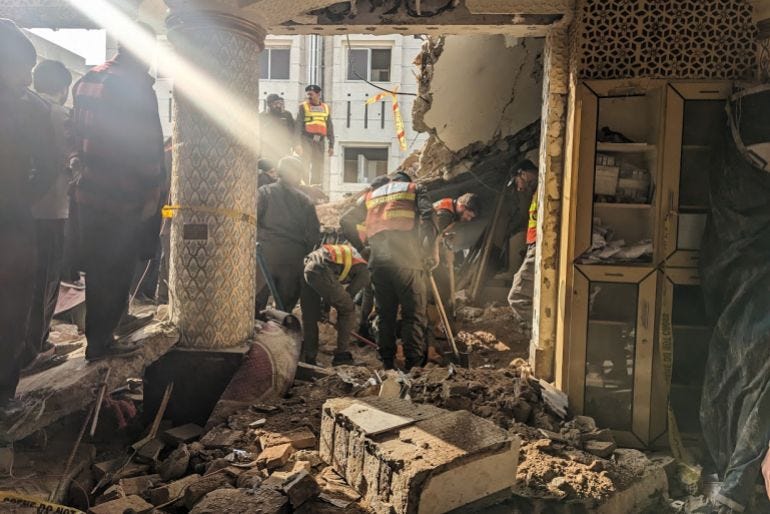 rescuers trying to clear the rubble to find people rescuers trying to clear the rubble to find people