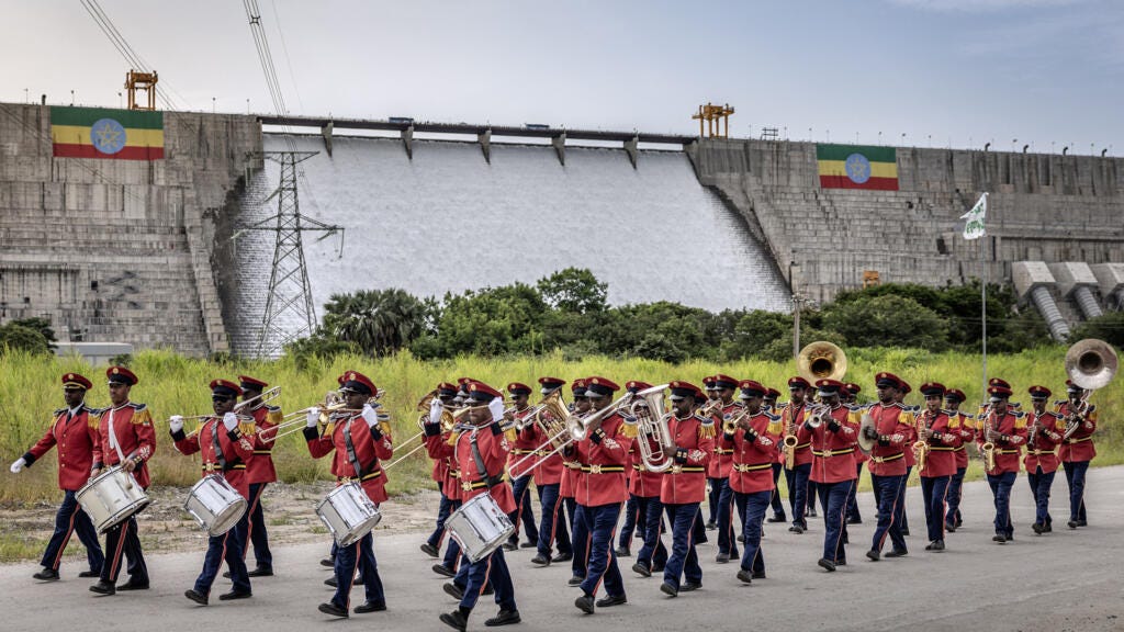 Members of the Ethiopian Republic March Band perform in front of the Grand Ethiopian Renaissance Dam (GERD) at of its official inauguration ceremony in Guba, on 9 September 2025.