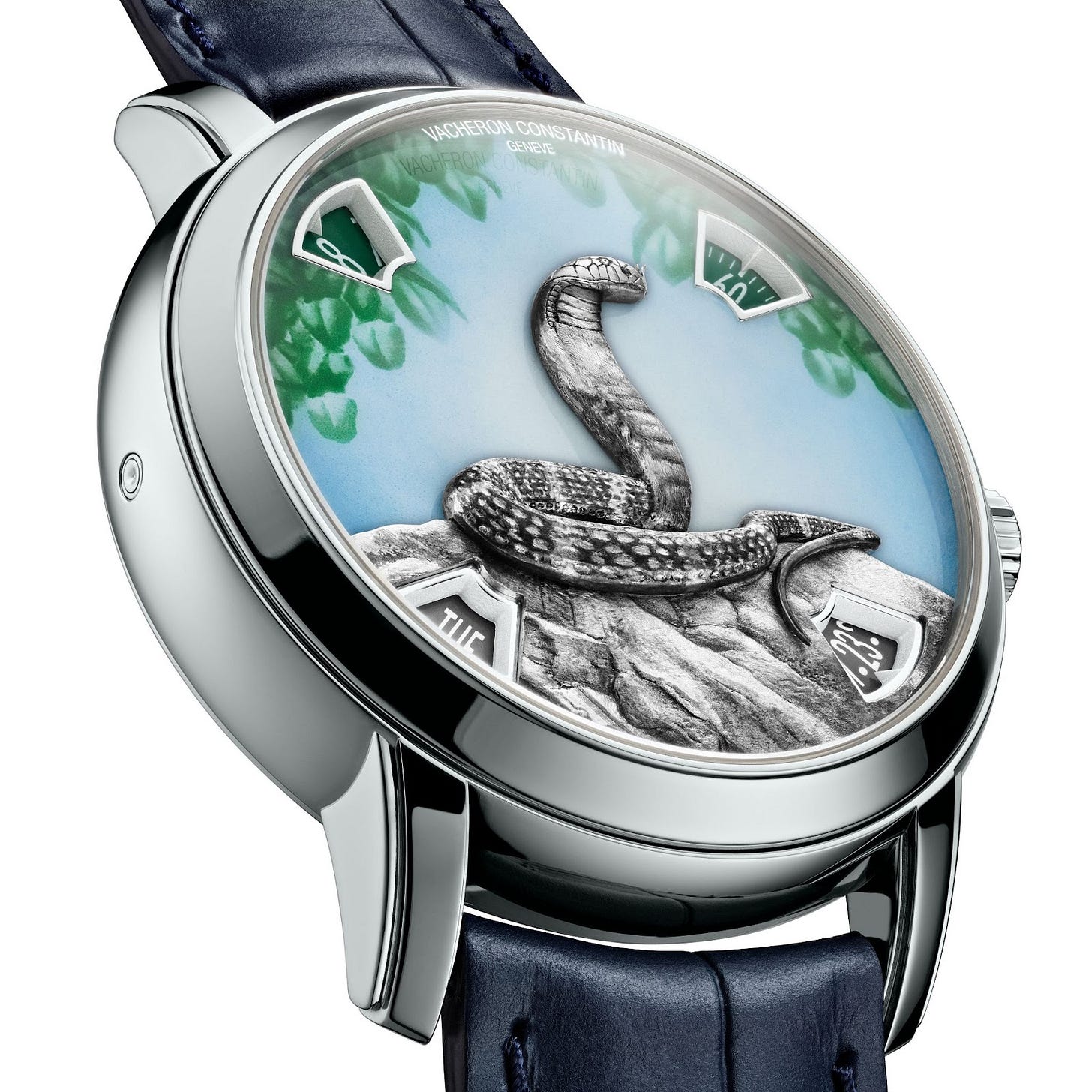 Close-up of the platinum Métiers d’Art Year of the Snake watch with green Grand Feu enamel, showcasing a detailed engraved cobra. Close-up of the platinum Métiers d’Art Year of the Snake watch with green Grand Feu enamel, showcasing a detailed engraved cobra.