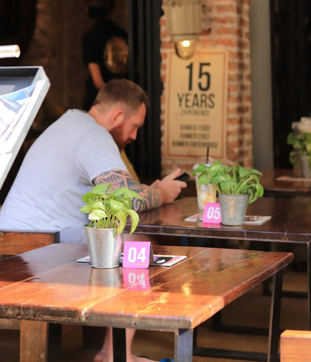 man in white shirt sitting at the table man in white shirt sitting at the table