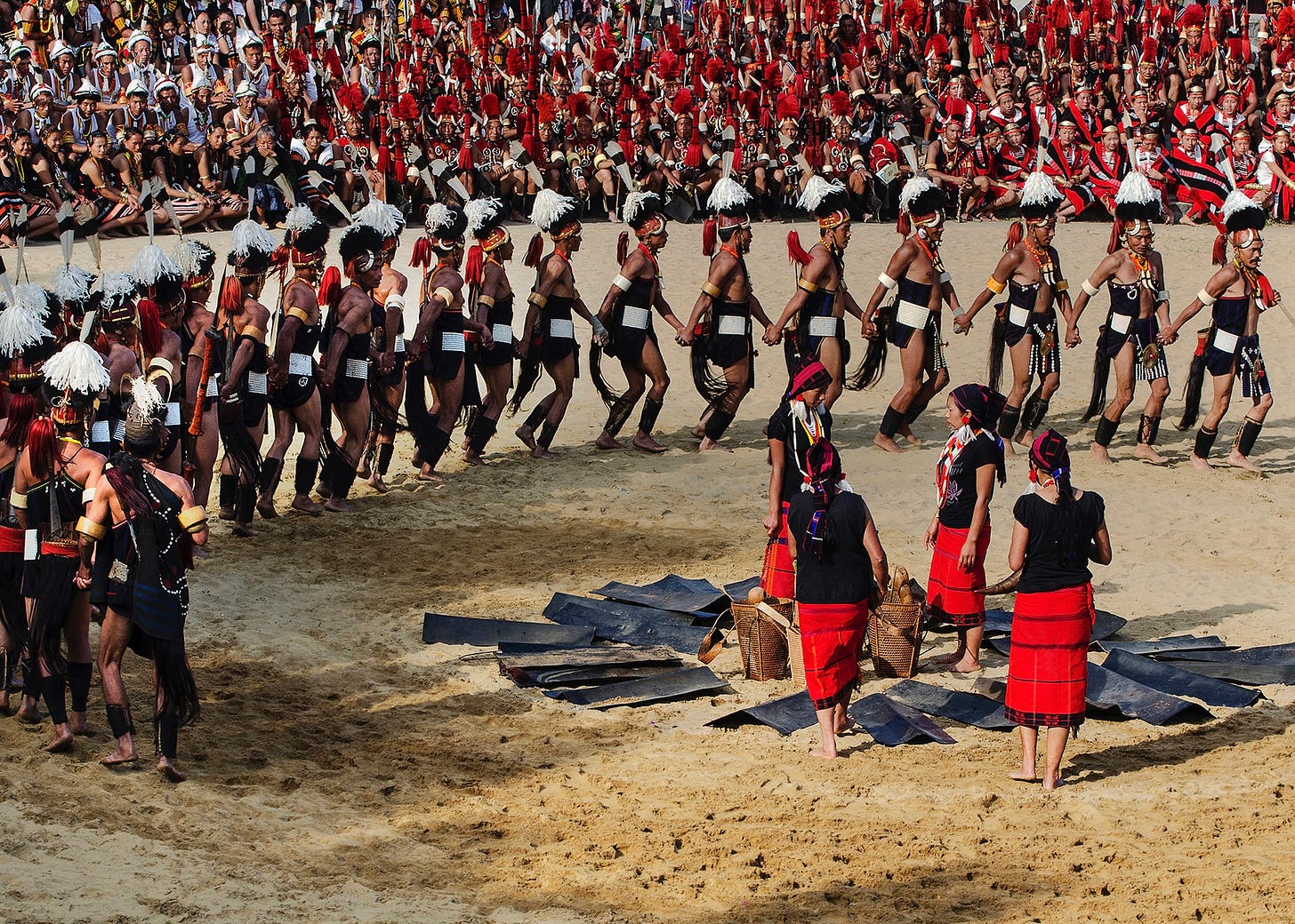 People performing the Chang dance during Nagaland’s Hornbill Festival, wearing colorful traditional Naga clothing. Photo by Bhrigu Kumar Bayan