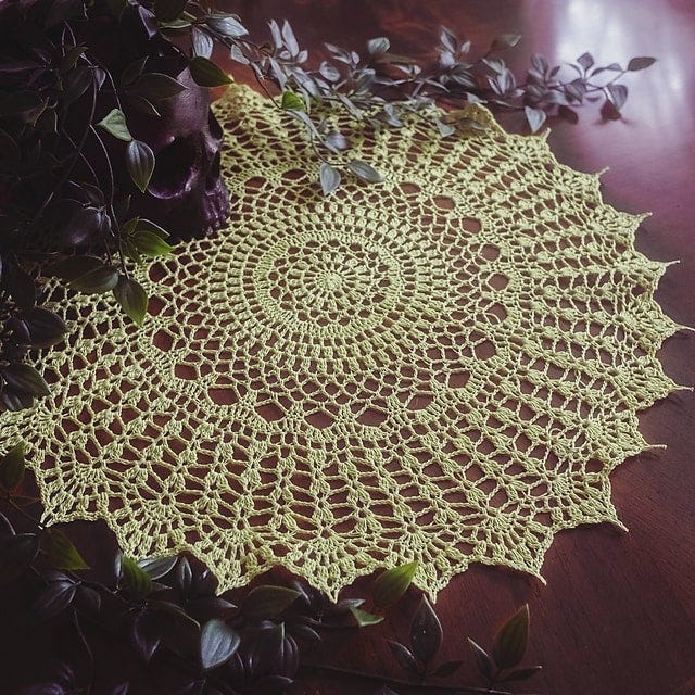 Summer Splendor Doily with detailed lacework and concentric crochet borders, crocheted by Kristin Lehrer. Pattern by Denise Augostine Owens. Summer Splendor Doily with detailed lacework and concentric crochet borders, crocheted by Kristin Lehrer. Pattern by Denise Augostine Owens.