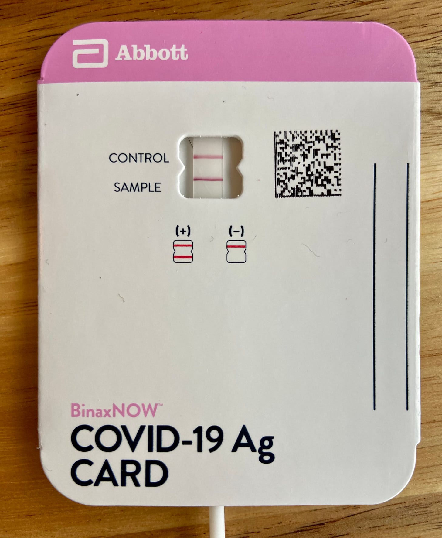 A Covid card with positive test result.