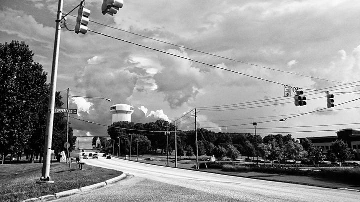 A wall of clouds cover the horizon beyond the Auburn University, Montomery water tower