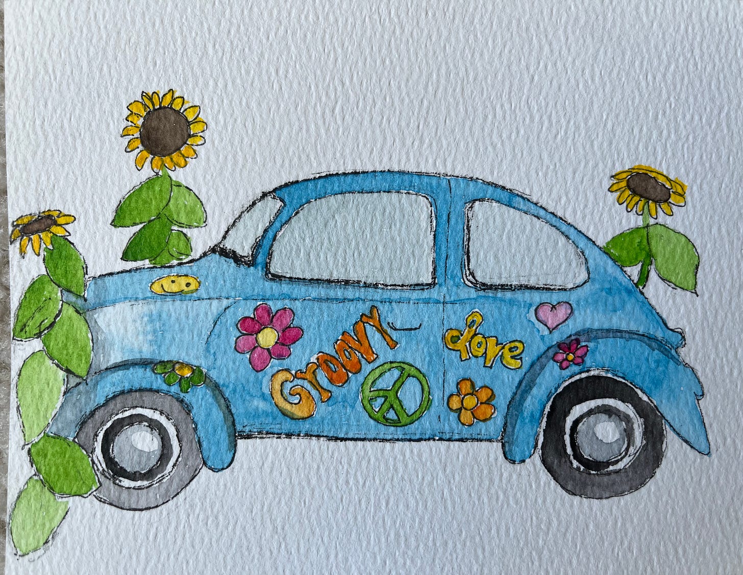 Photo of a watercolor and ink illustration of a vintage Volkswagen Beetle with sunflowers.