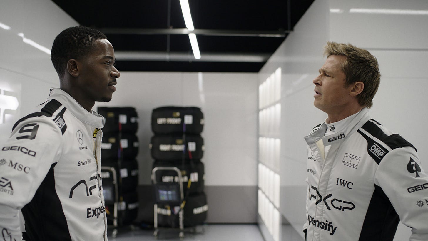 Damson Idris as Joshua Pearce and Brad Pitt as Sonny Hayes in Apple Original Films’ “F1 The Movie,” only in theaters and IMAX 27 June 2025.