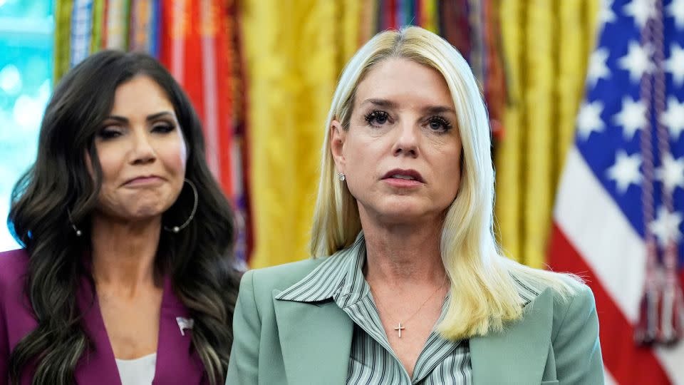Attorney General Pam Bondi, right, and Homeland Security Secretary Kristi Noem listen as President Donald Trump speaks in the Oval Office on Monday. - Alex Brandon/AP