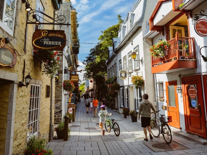 The immense comfort of zero-setback, narrow streets in Vieux Quebec. Source