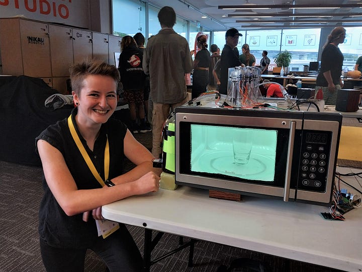 Images of a microwave modified to dispense drinks, one of which contains the author smiling beside the machine