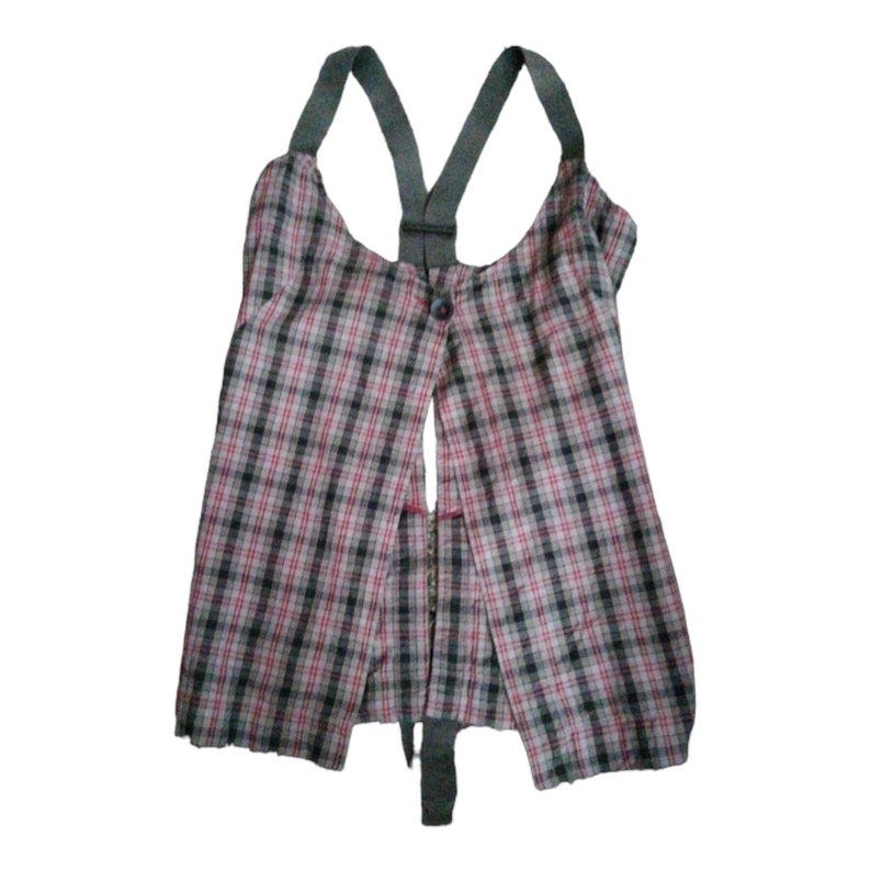 May include: A sleeveless plaid top with a black and gray plaid pattern and a black strap detail. The top is open in the front and has a button closure.