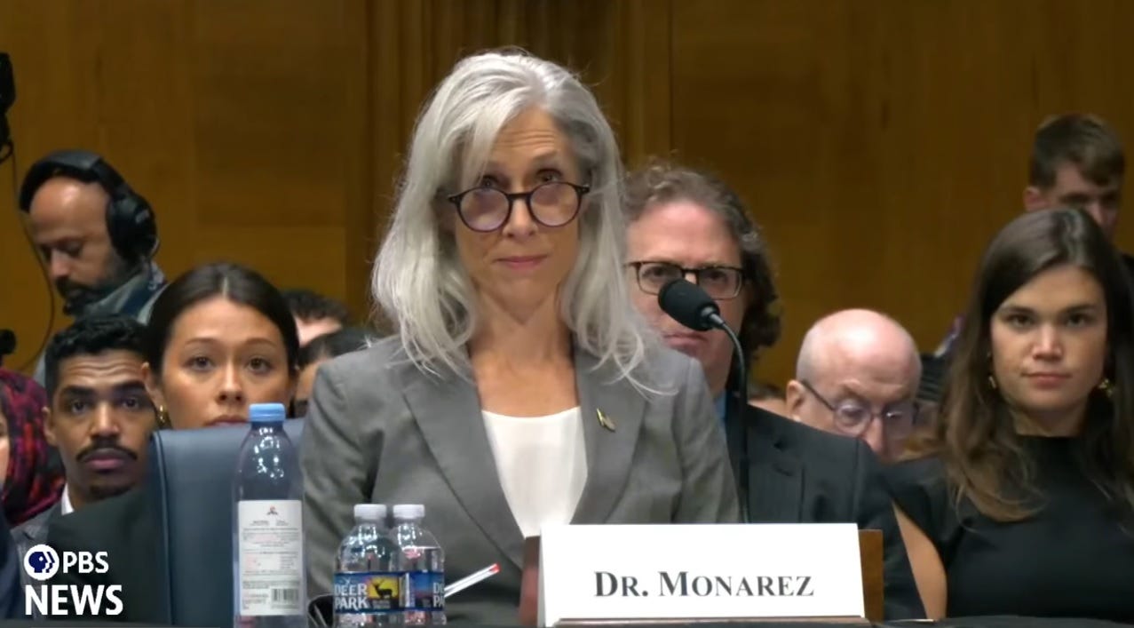 Video screenshot: Dr. Susan Monarez looks up over the tops of her glasses as she reads her opening statement. Video screenshot: Dr. Susan Monarez looks up over the tops of her glasses as she reads her opening statement.