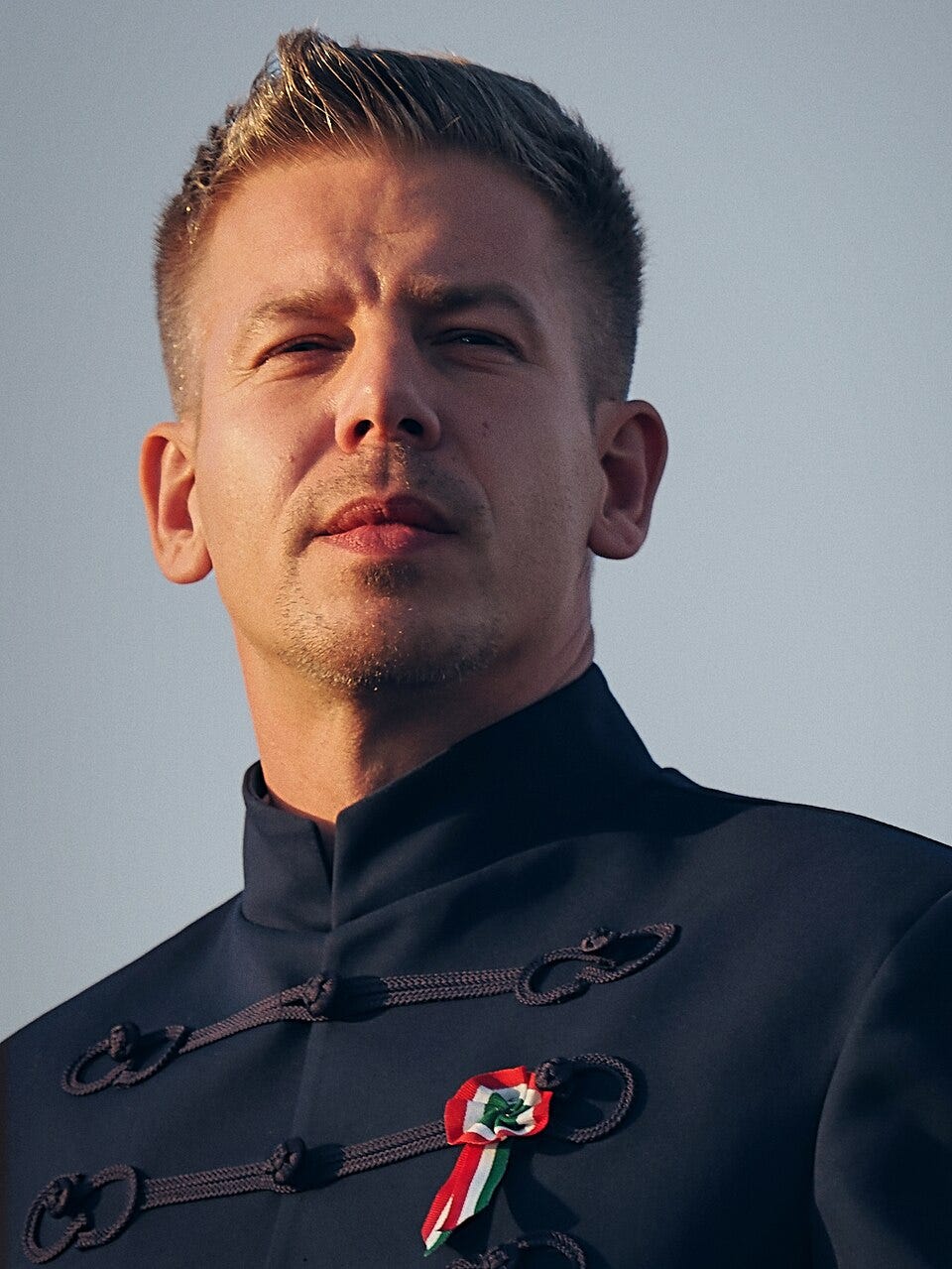 Close-up portrait of Péter Magyar at Heroes’ Square in Budapest on 15 March 2026, wearing a traditional bocskai jacket and a Hungarian cockade during a national day demonstration. Close-up portrait of Péter Magyar at Heroes’ Square in Budapest on 15 March 2026, wearing a traditional bocskai jacket and a Hungarian cockade during a national day demonstration.