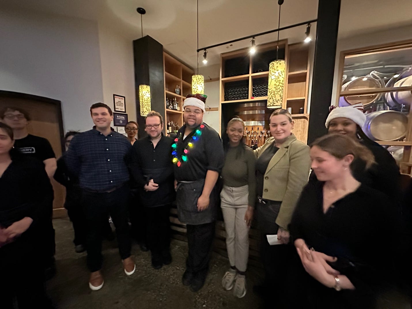 A group of people posing for a photo

Description automatically generated