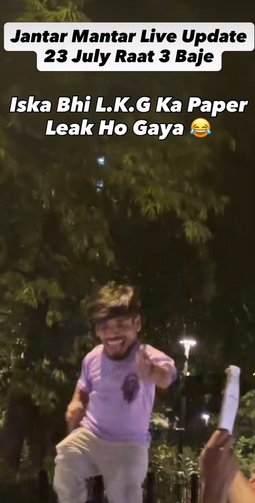 A little person dancing. Translated caption reads, “Jantar Mantar live update at 3am on 23 July. This one’s LKG paper has leaked.” A little person dancing. Translated caption reads, “Jantar Mantar live update at 3am on 23 July. This one’s LKG paper has leaked.”