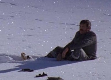 A person sitting in the snow

AI-generated content may be incorrect.