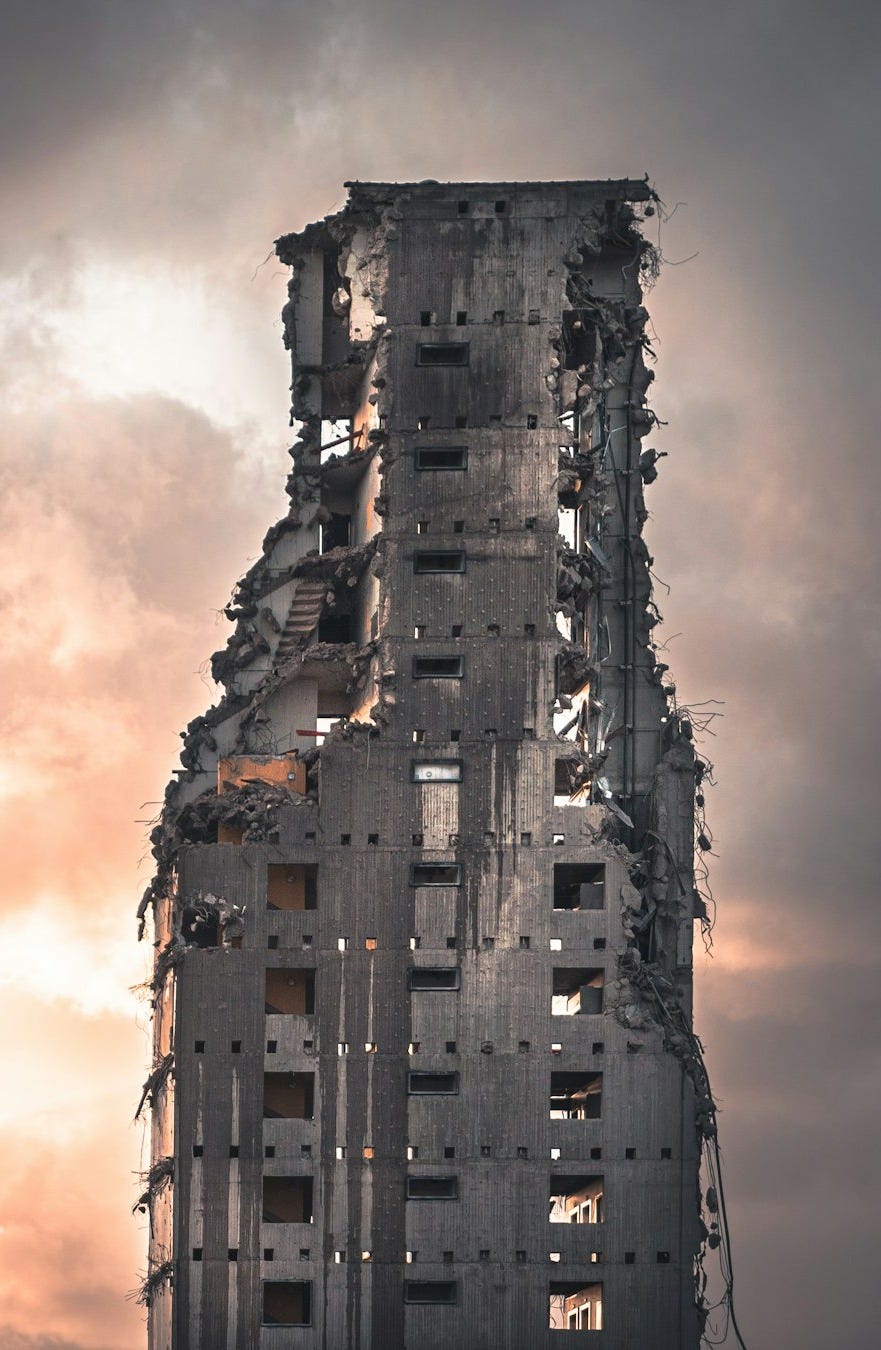 brown concrete building under cloudy sky during daytime