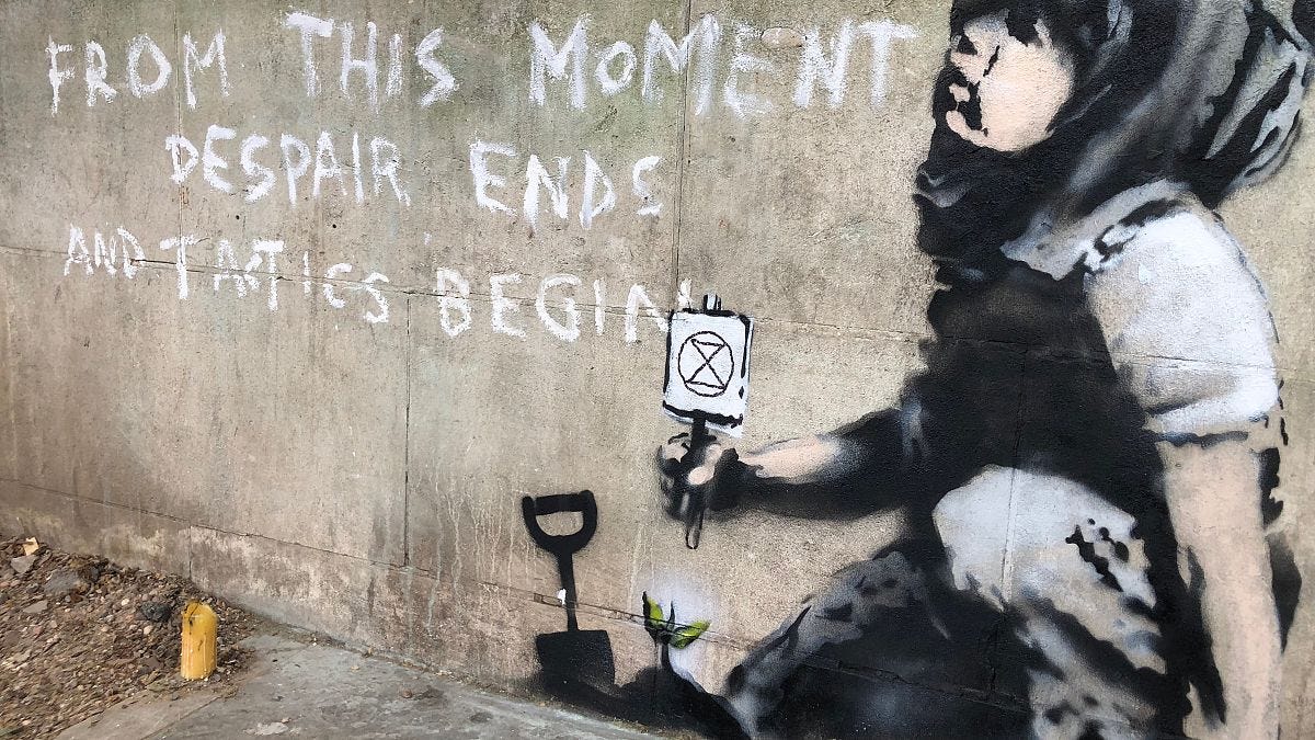 New Banksy appears overnight as climate protests come to a close in ...