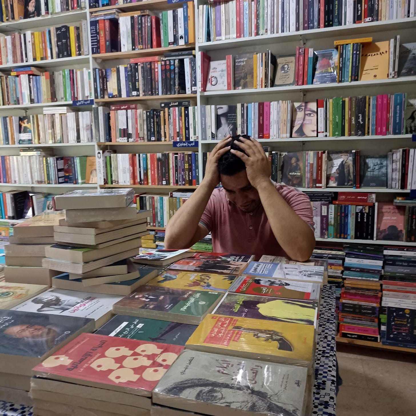 May be an image of book, newsstand and text