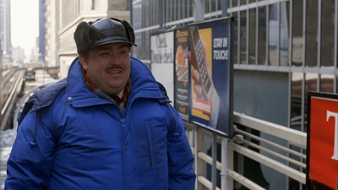 In Planes, Trains and Automobiles (1987) a poster reading "Stay in touch"  is seen behind Del when he parts ways with Neal at the subway station in  Chicago : r/MovieDetails