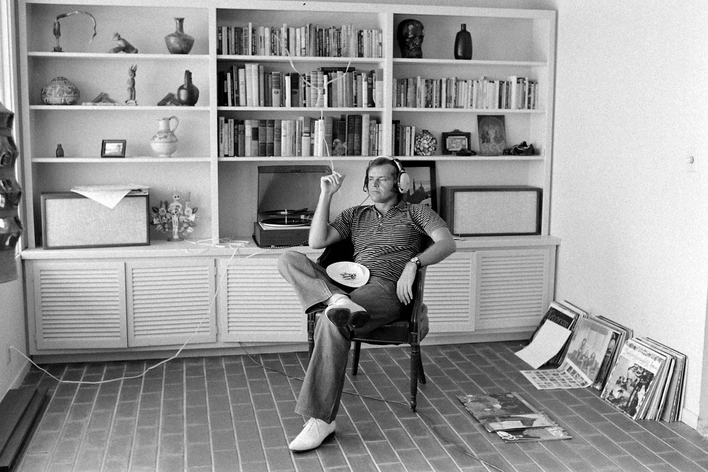Actor Jack Nicholson listening to music. Actor Jack Nicholson listening to music.