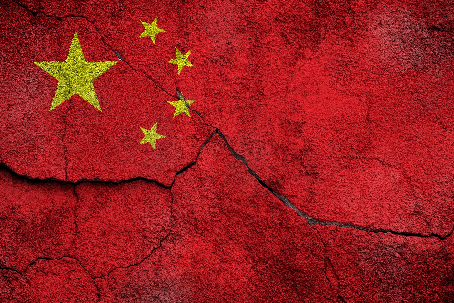 The Chinese flag on cracked concrete The Chinese flag on cracked concrete
