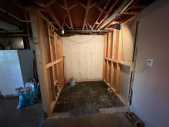 Four images showing a bathroom being demolished.