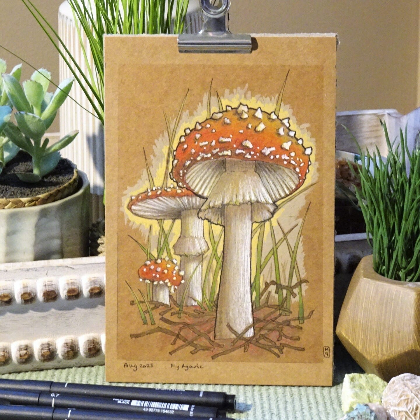 A whimsical painting of three amanita muscaria (fly agaric): small, medium, and large A whimsical painting of three amanita muscaria (fly agaric): small, medium, and large