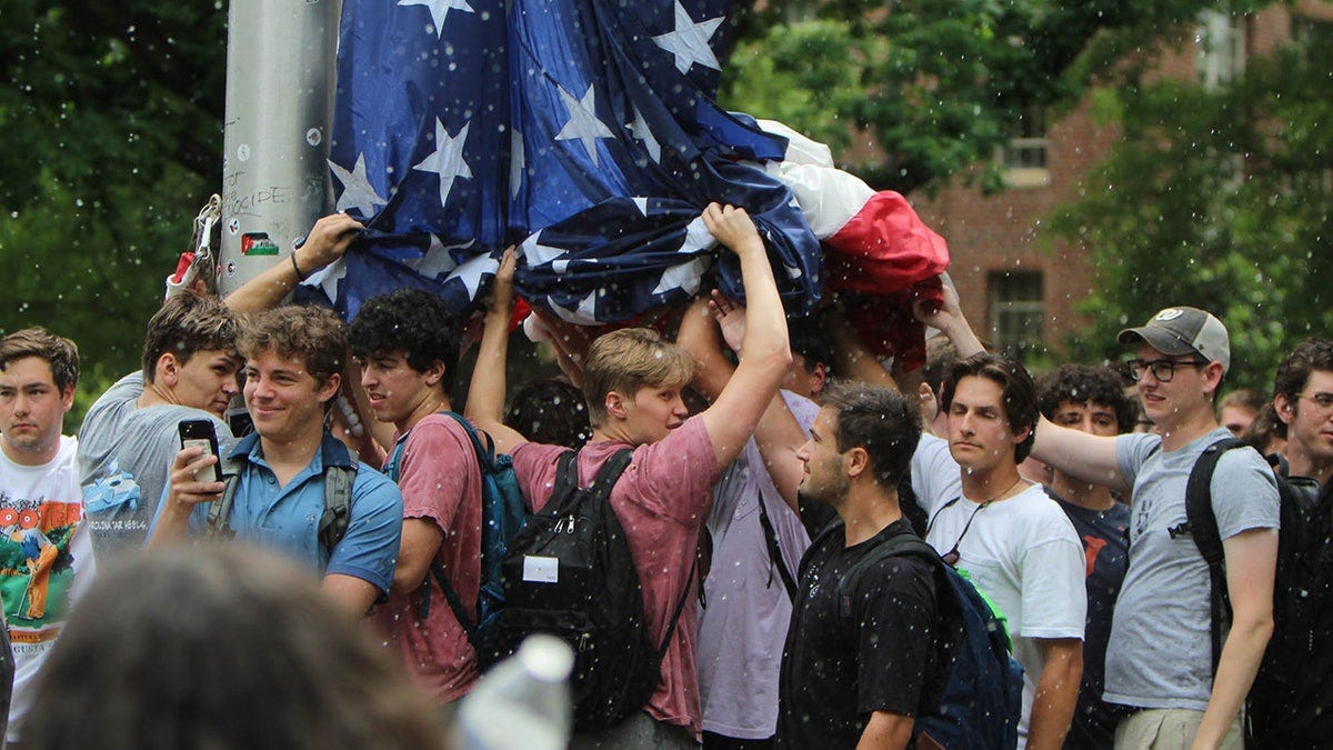 UNC fraternity brothers honored for defending the American flag against ...