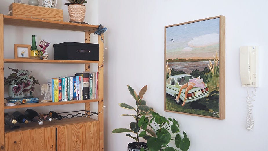 Canvas in floating frame on wall