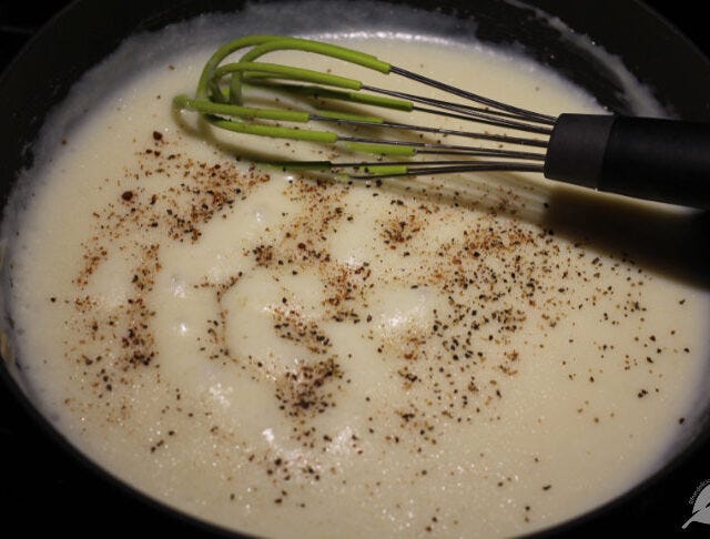 Gradually add milk, constantly whisking to avoid lumps. Bring the mixture to a boil while whisking it regularly. Reduce heat to low and allow the sauce to simmer for several minutes to thicken up. Gradually add milk, constantly whisking to avoid lumps. Bring the mixture to a boil while whisking it regularly. Reduce heat to low and allow the sauce to simmer for several minutes to thicken up.