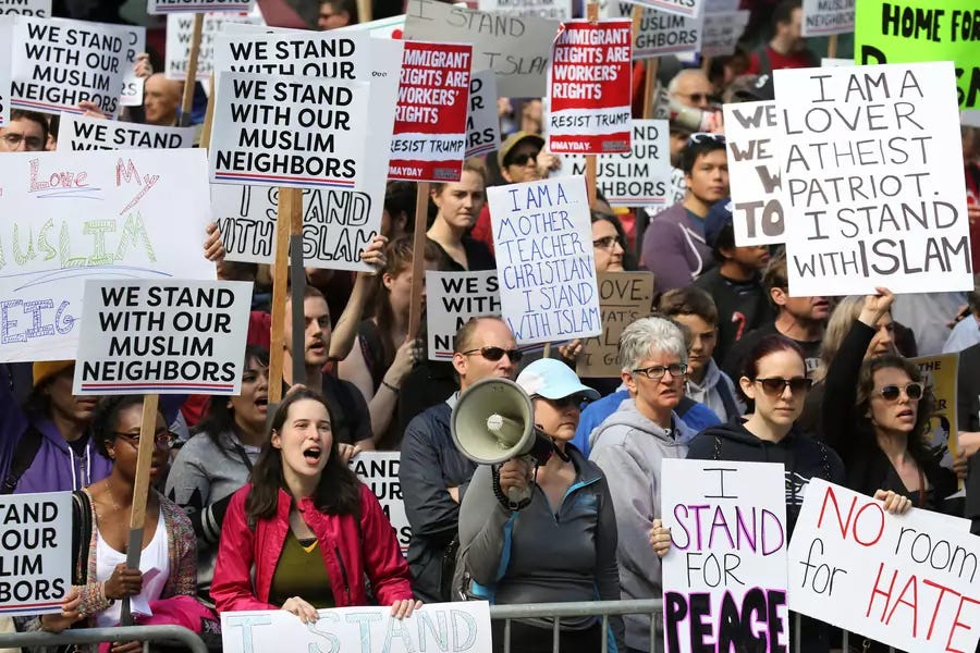 Counter-protesters hold signs and shout slogans during an anti-Sharia rally in Seattle. Counter-protesters hold signs and shout slogans during an anti-Sharia rally in Seattle.