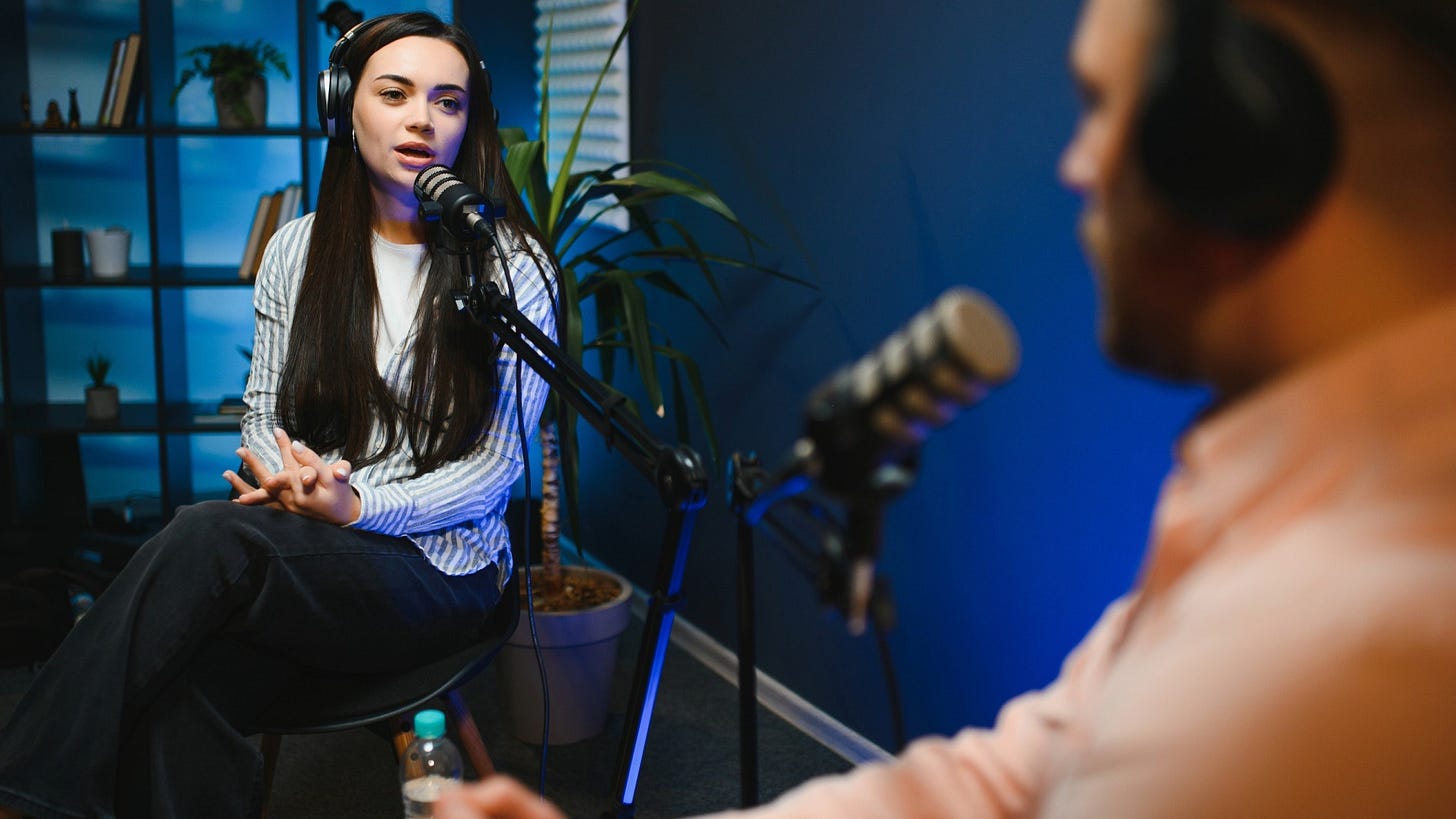 A podcaster interviews a woman about her thoughts on a topic