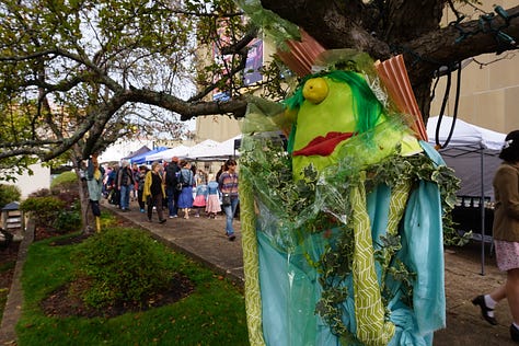 Scarecrows wear old clothing, colourful accessories, and funny expressions on their faces as they stand propped up against lampposts and other landmarks in Charlottetown.
