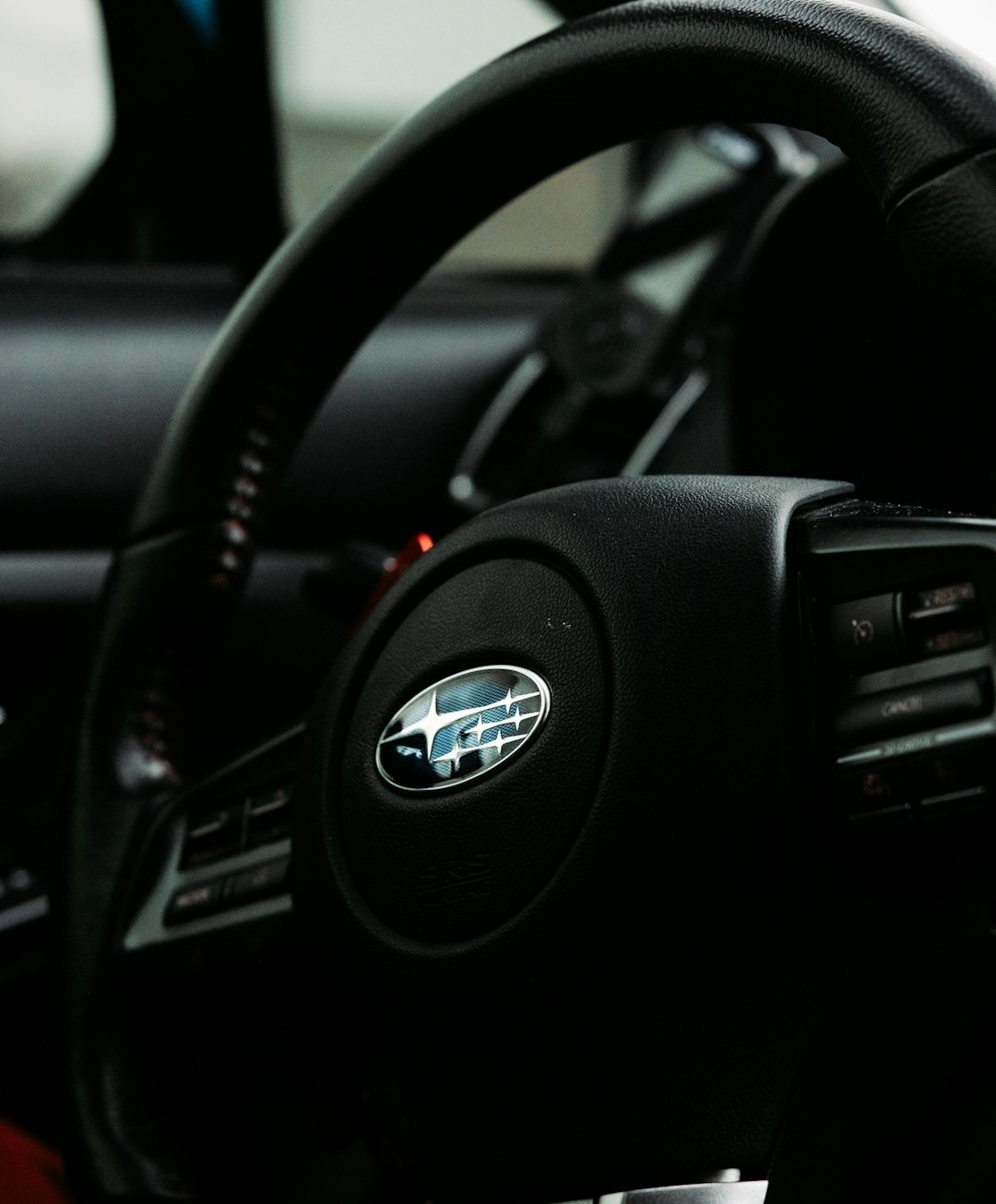 black nissan car steering wheel