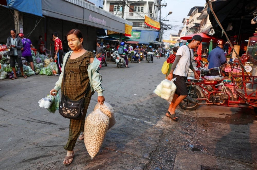 A migrant worker from Myanmar walks through a local market in Mae Sot, Thailand, on Feb. 21.
A migrant worker from Myanmar walks through a local market in Mae Sot, Thailand, on Feb. 21.