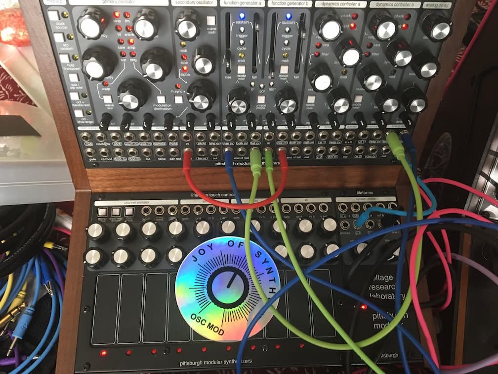 Synthesizer with cables connected.