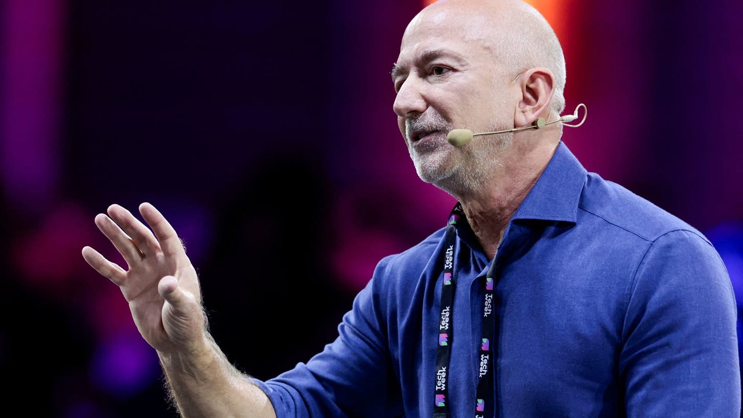 Amazon founder Jeff Bezos gestures as he speaks at the main panel of Italian Tech Week 2025 in Turin, Italy October 3, 2025. REUTERS/Remo Casilli