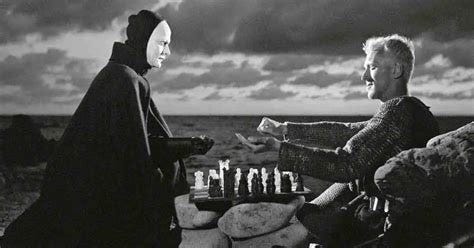 Still from the black and white movie The Seventh Seal, by Igmar Bergman, in which a grey haired man plays a game of chess with a man made up to look like Death, the Grim Reaper.