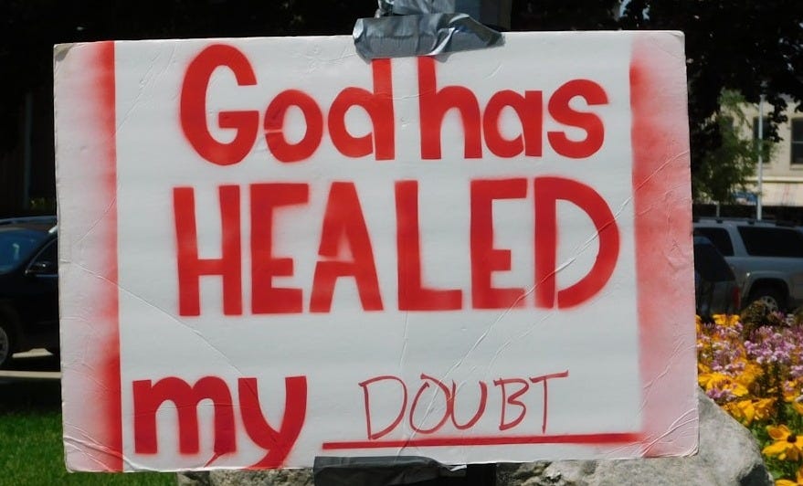 God has healed my doubt placard posted on pole