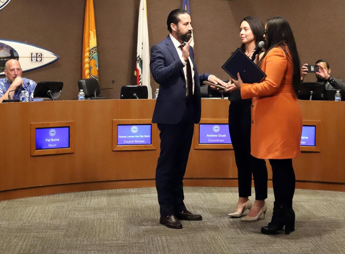Andrew Gruel is sworn in as a new Huntington Beach City Council member during Tuesday night's meeting.