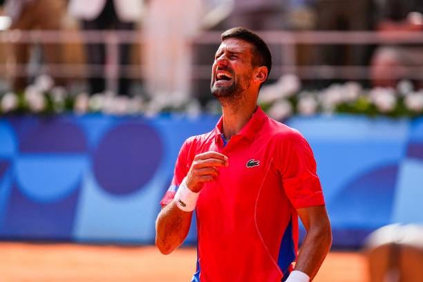 Novak Djokovic of Serbia celebrates after winning against Carlos Alcaraz of Spain during the Men's Singles Gold medal match on Court...