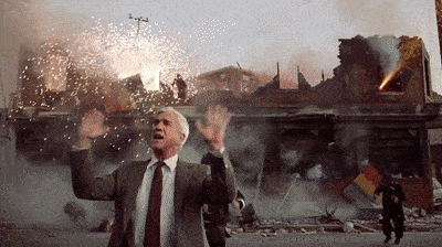 Animated gif from The Naked Gun showing Frank Drebin standing in front of a chaotic explosion scene, waving his arms and saying “Nothing to see here,” used to parody the poll’s refusal to acknowledge its own systemic flaws.