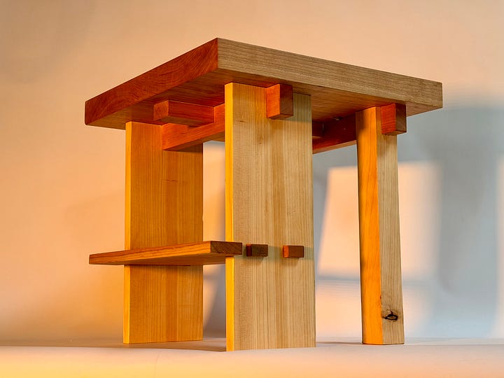 messy sketch of table on left, finished product with dramatic lighting on the right.