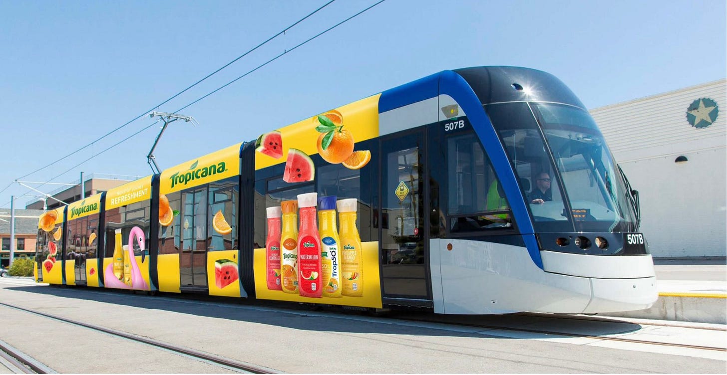 ion train superimposed with a Tropicana juice ad wrap along the side exterior. ion train superimposed with a Tropicana juice ad wrap along the side exterior.
