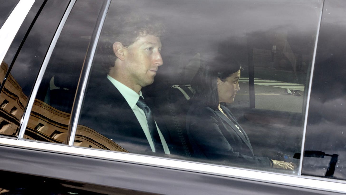 Meta CEO Mark Zuckerberg, left, arrives at federal court in Washington, DC on Wednesday for the trial portion of the Federal Trade Commission's antitrust lawsuit.