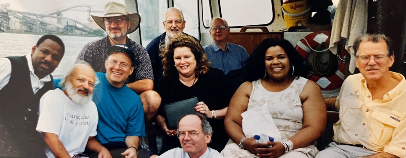 A group of people sitting on a boat

Description automatically generated with medium confidence