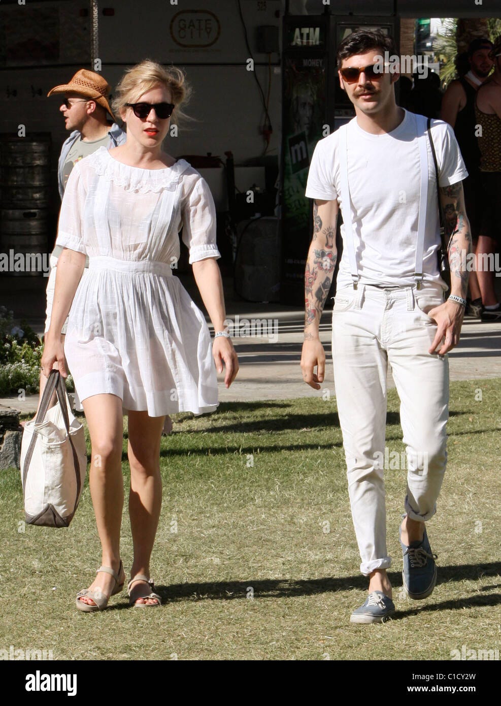Chloe Sevigny walking with her boyfriend wearing a white see through dress  at the Coachella Music Festival 2009 - Day 3 Indio Stock Photo - Alamy