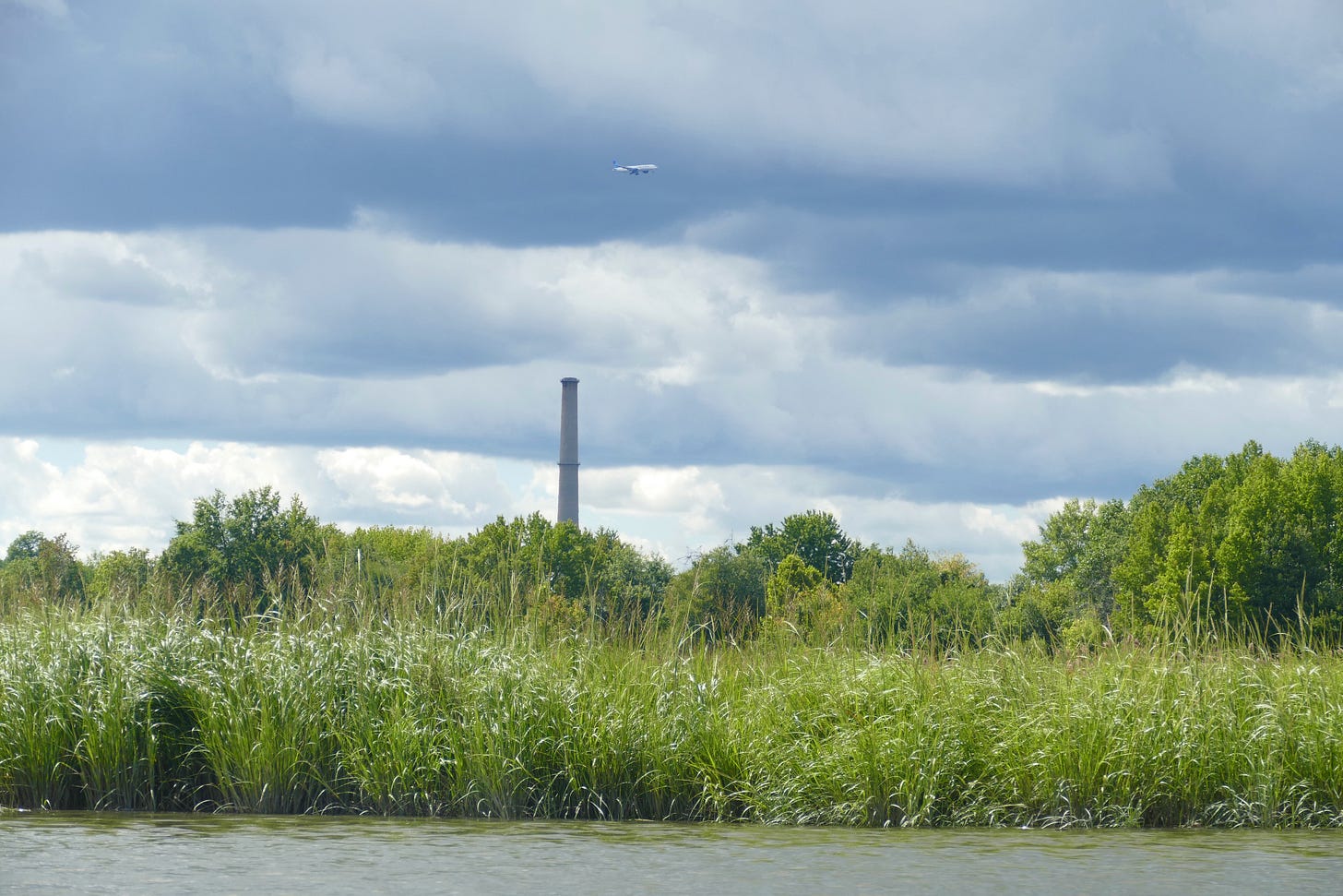 Freshkills marsh with smokestack and jumbo jet