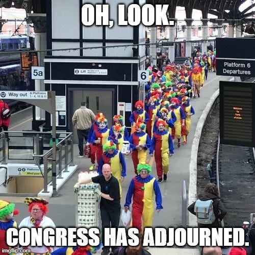 This may contain: a group of clowns that are walking down the street with captioning, oh look congress has abandoned